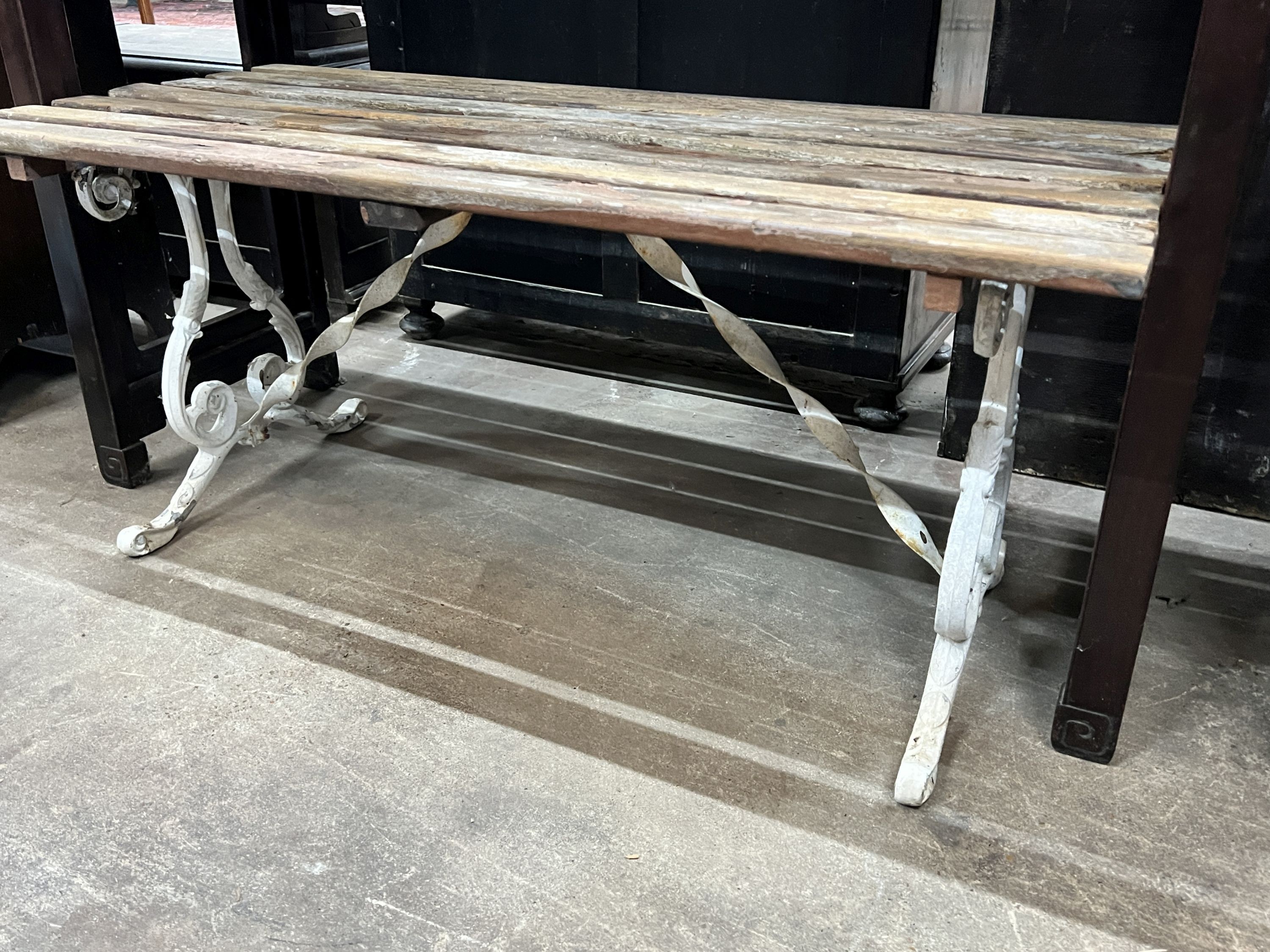 A painted aluminium garden seat, length 110cm, together with a similar smaller seat